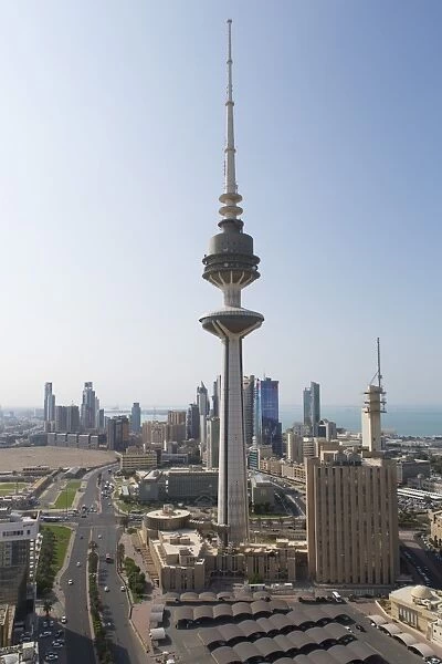 Elevated view of the modern city skyline and central business district with Liberation Tower, Kuwait City, Kuwait, Middle East
