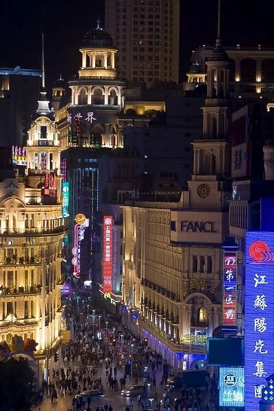 Elevated view along Nanjing Donglu Road illuminated with neon signs at night