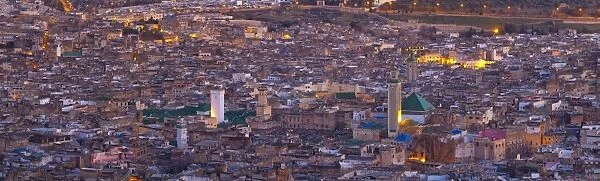 Elevated view across the Old Medina of Fes illuminated at dusk, UNESCO World Heritage Site, Fes, Morocco, North Africa, Africa
