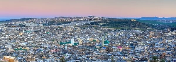 Elevated view across the Old Medina of Fes illuminated at dusk, UNESCO World Heritage Site, Fes, Morocco, North Africa, Africa