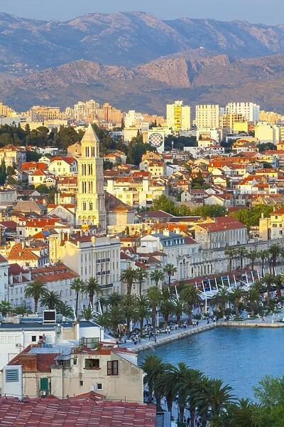 Elevated view over Splits picturesque Stari Grad and harbour illuminated at sunset, Split, Dalmatia, Croatia, Europe