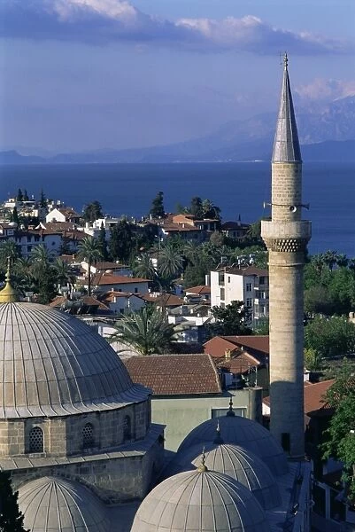 Elevated view of town with dome and minaret of mosque in foreground