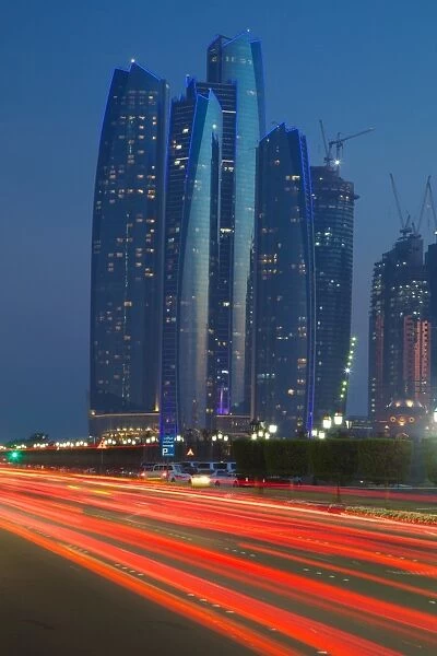 Emirate Towers and car tail lights at night, Abu Dhabi, United Arab Emirates, Middle East