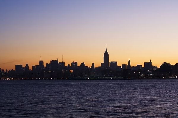 Empire State Building and Mid Town skyline at dawn