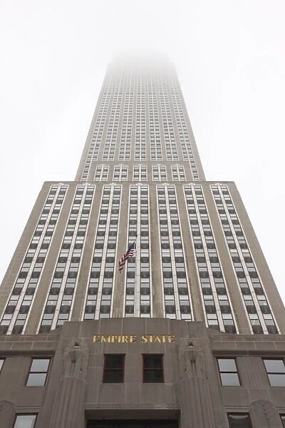 Empire State Building shrouded in mist, Manhattan, New York City, New York