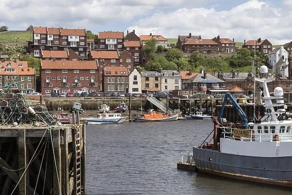 Endeavour Wharf with lobster pots and boats in Upper Harbour, Whitby, North Yorkshire