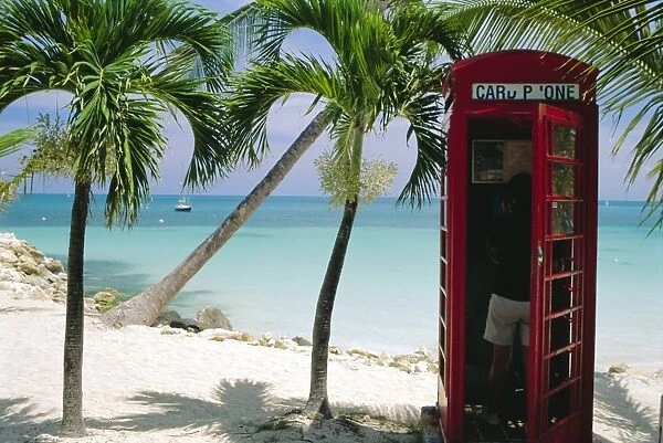 English telephone box on the beach, Dickensons Bay, North-East coast