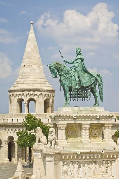 Equestrian statue of King Stephen with the towers and conical turrets of the neo-romanesque Fishermens Bastion, built by Frigyes Schulek in 1895, Budapest