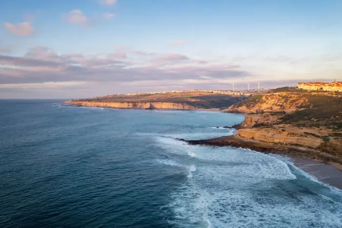 Framed Print : Ericeira drone aerial view on the coast of Portugal with surfers on the sea at sunset, Lisbon area, Portugal, Europe Framed Print : Ericeira drone aerial view on the coast of Portugal with surfers on the sea at sunset, Lisbon area, Portugal, Europe
