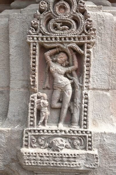 Erotic carving of woman on the 11th century Rajarani temple, known as the love temple, dedicated to Lord Shiva, Bhubaneshwar, Orissa, India, Asia