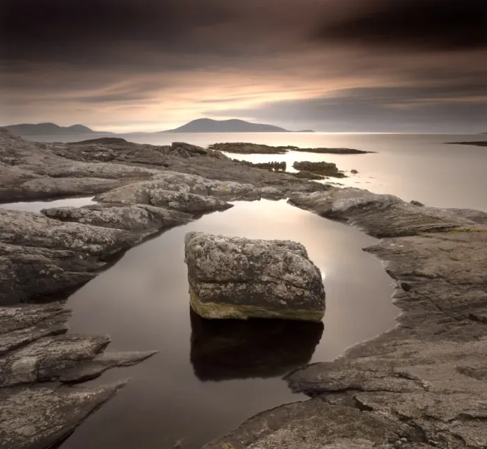 Framed Print : Erratic in tidal pool on isle of Taransay, looking towards Toe Head on South Harris Framed Print : Erratic in tidal pool on isle of Taransay, looking towards Toe Head on South Harris