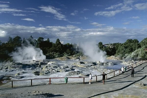 Erupting geysers and mineral terraces