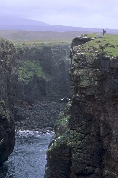 Eshaness basalt cliffs, Calders Geo, ancient volcanic crater, coast deeply eroded with caves