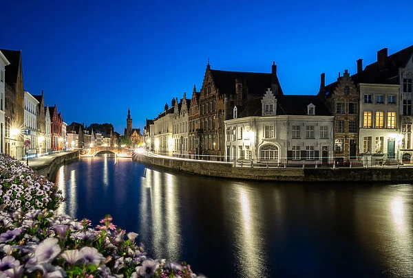 An evening blue hour scene along the canals of Bruges, Belgium, Europe