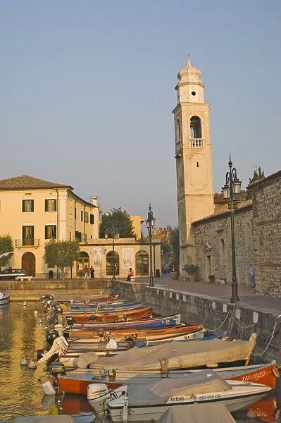 Evening light over the harbour and campanile at Lazise