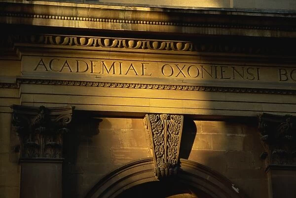 Evening light on inscription on Sheldonian Theatre, Oxford, Oxfordshire