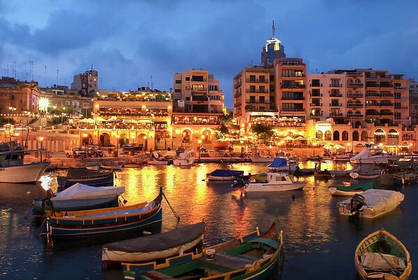 Evening across Spinola Bay with restaurants, St. Julian`s, Malta, Mediterranean, Europe
