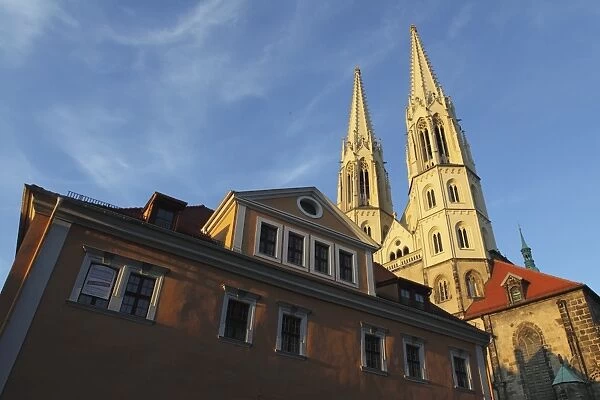 Evening sunshine lights the Neo-Gothic spires of the medieval St. Peters Church