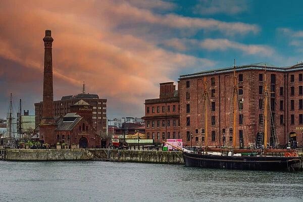 Evening view of Royal Albert Dock brick and stone buildings and warehouses, including The Pumphouse, Liverpool, Merseyside, England, United Kingdom, Europe