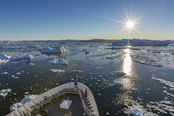 Expeditions ship amongst huge icebergs, Ilulissat, Greenland, Polar Regions
