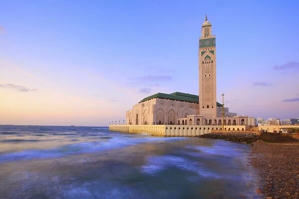 Exterior of Hassan ll Mosque and coastline at dusk, Casablanca, Morocco, North Africa