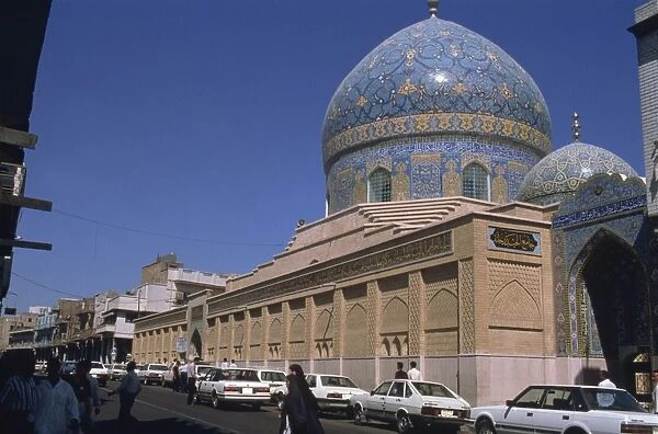 Exterior of the Sheikh Omar Mosque with blue tiles on dome