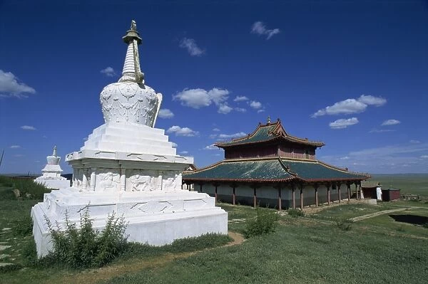 Exterior of white stupa (pagoda) and monastery building