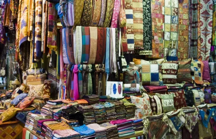 Framed Print : Fabrics, rugs, scarves, cushions for sale, Grand Bazaar (Great Bazaar)