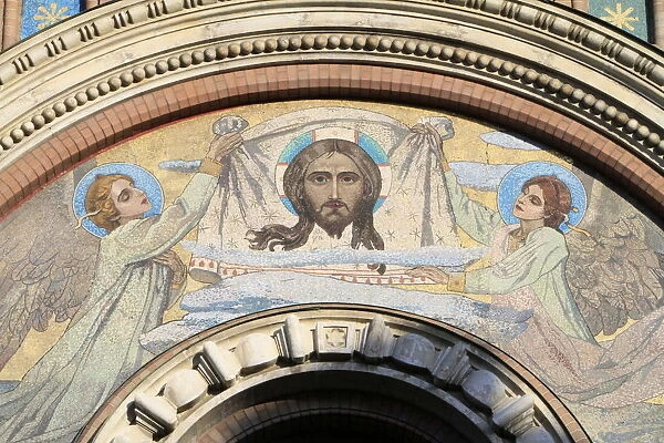 Facade mosaic of two angels supporting a Vernicle with the image of Christ