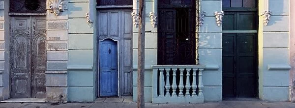 Facade of old colonial house in evening light, Cienfuegos, Cuba, West Indies