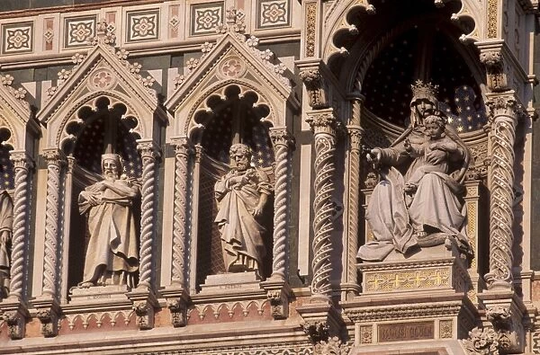 Detail of the facade of polychrome marble of the Duomo