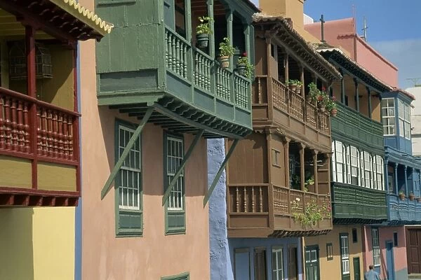 Facades of painted houses with overhanging wooden balconies in Santa Cruz de la Palma