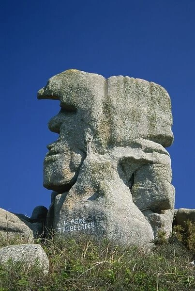 Faces in the rocks, Le Pere Trebeurden, at Trebeurden on the Cote de Granit Rose on the Cotes d Amor, Brittany