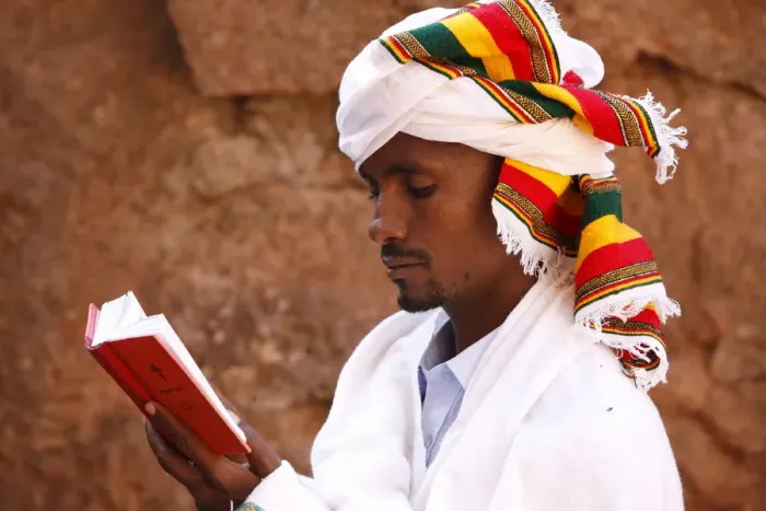 Framed Print : Faithful reading outside a church in Lalibela, Ethiopia, Africa Framed Print : Faithful reading outside a church in Lalibela, Ethiopia, Africa