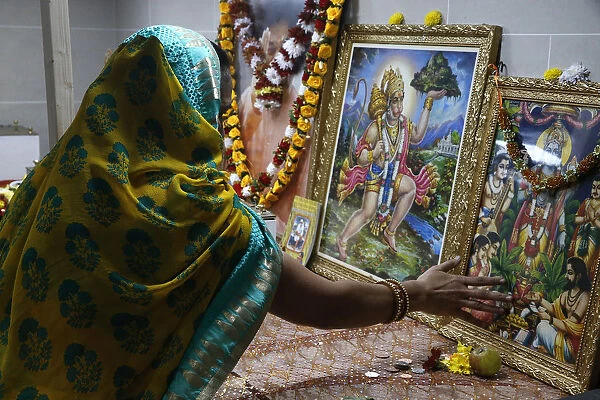 Faithful touching pictures of deities, Shree Ram Mandir, Leicester, Leicestershire
