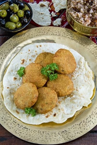 Falafel, a deep-fried balls or patties made from ground chickpeas and or fava beans, Arabic Countries