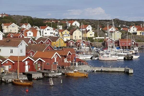 Falu red fishermens houses in harbour, Halleviksstrand, Orust, Bohuslan Coast, Southwest Sweden