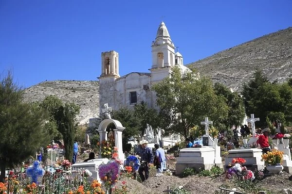 Families decorating graves for Day of the Dead, Templo de Guadalupe, Real de Catorce