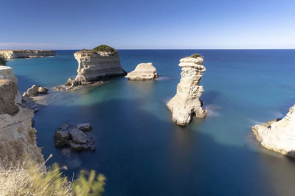 Faraglioni (limestone stacks) of Torre Sant Andrea in the crystal sea, Lecce province