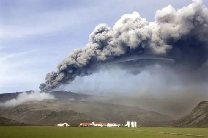 Framed Print : Farm buildings and green fields with the ash plume of the Eyjafjallajokull eruption in the distance Framed Print : Farm buildings and green fields with the ash plume of the Eyjafjallajokull eruption in the distance