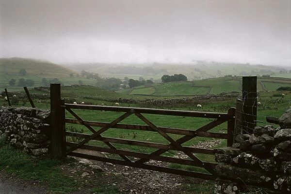 Farm gate and overcast skies near Malham, Yorkshire Dales National Park