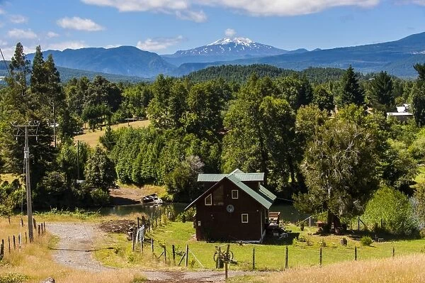 Farmhouse below the Volcano Villarrica and the beautiful landscape, Southern Chile, South America