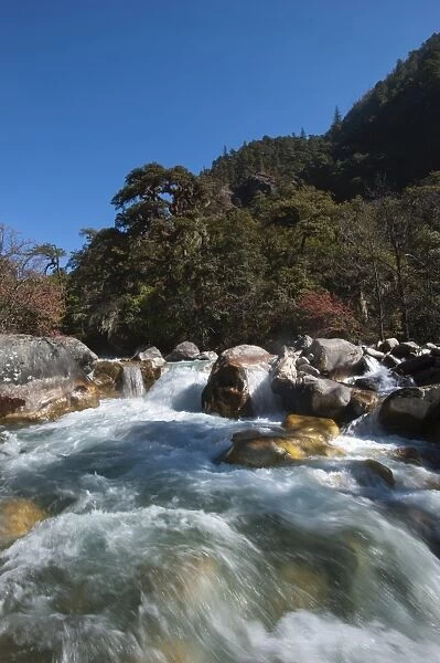 Fast flowing melt water near Thangthanka in Bhutan, Asia