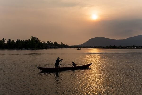 Father and son fishing on Kampong Bay River at sunset, Kampot, Cambodia, Indochina, Southeast Asia, Asia