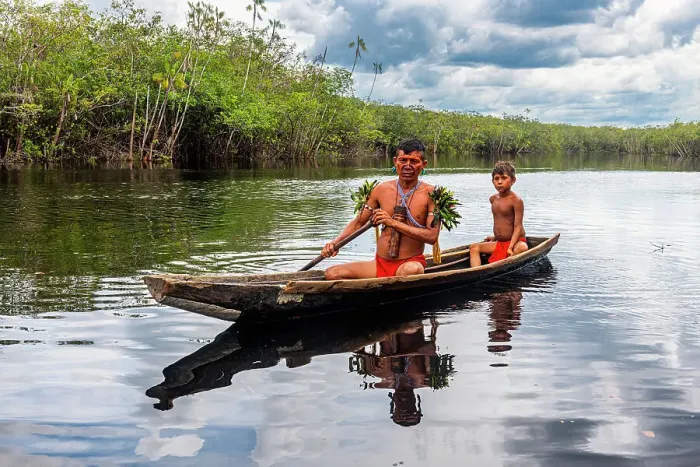 Framed Print : Father and son from the Yanomami tribe in a canoe, southern Venezuela, South America Framed Print : Father and son from the Yanomami tribe in a canoe, southern Venezuela, South America