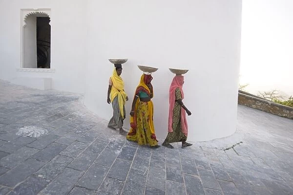 Three female construction workers at the Monsoon Palace, Udaipur, Rajasthan, India, Asia