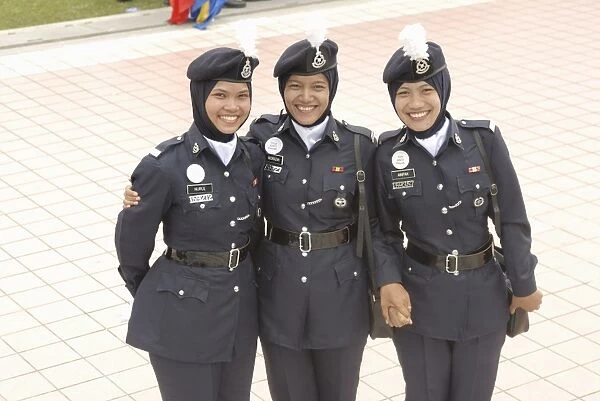 Three female police force members at celebrations of