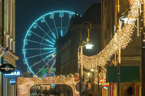 Ferris wheel at Christmas markets at twilight, Poznan, Poland, Europe