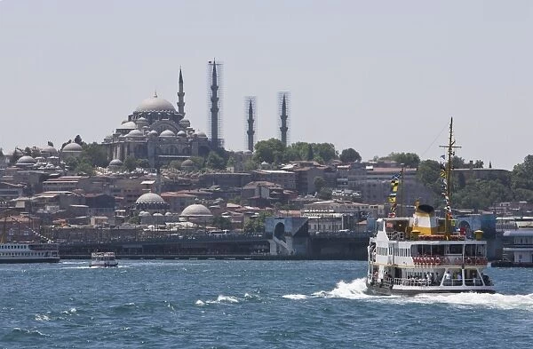 Ferry boat on Bosphorus with the Suleymaniye Mosque in the distance, Istanbul
