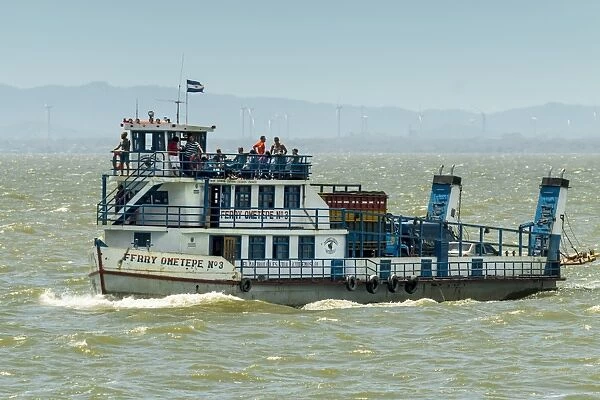 Ferry heading from San Jorge to Omotepe Island, carrying tourists, locals and freight, Isla Omotepe, Lake Nicaragua, Nicaragua, Central America